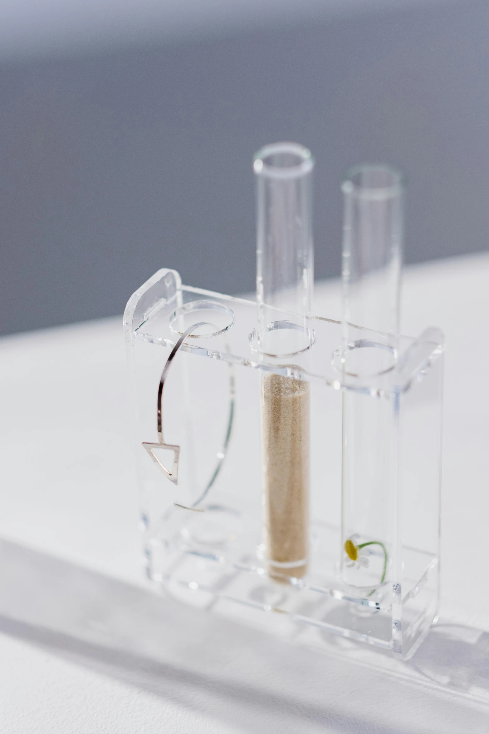 a couple of glasses sitting on top of a table, cell automata, botanicals, ultra clear material, product shot