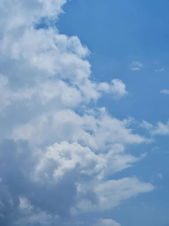 a person flying a kite on a cloudy day, by Carey Morris, minimalism, layered stratocumulus clouds, profile image, ☁🌪🌙👩🏾, light blue sky