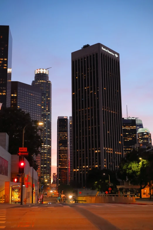 a city street filled with lots of tall buildings, an album cover, inspired by L. A. Ring, flickr, renaissance, at dusk!, megatall building, square, wikipedia