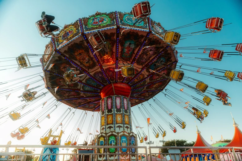 a carnival ride with lots of people on it, pexels contest winner, maximalism, 🚿🗝📝, profile image, swings, fantasy village