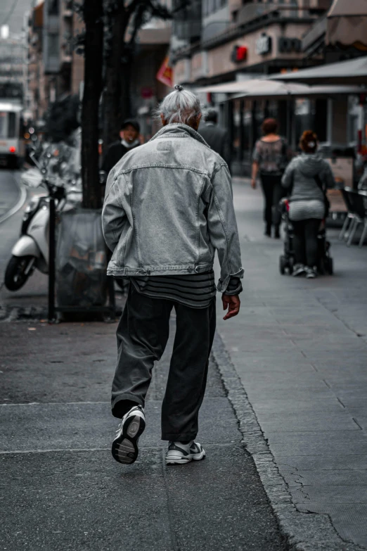 an old man walking down a city street, pexels contest winner, happening, grey jacket, worn pants, wearing ragged clothing, white and grey