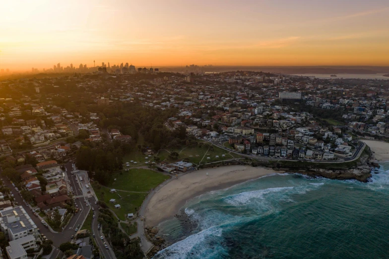 an aerial view of the city of sydney at sunset, pexels contest winner, standing near the beach, sydney hanson, high quality photo, brown