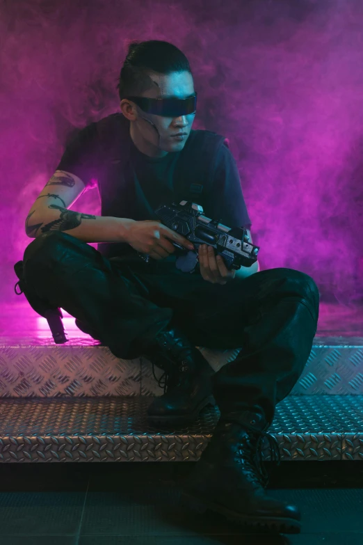 a man sitting on top of a bed holding a gun, cyberpunk art, inspired by Zhu Da, pexels, wearing space techwear, cyber goggles, concert, tactical
