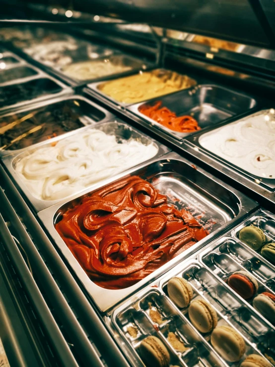 a display case filled with lots of different types of food, by Daniel Lieske, trending on unsplash, process art, pepperoni, sauce, 💋 💄 👠 👗, gleaming silver and rich colors