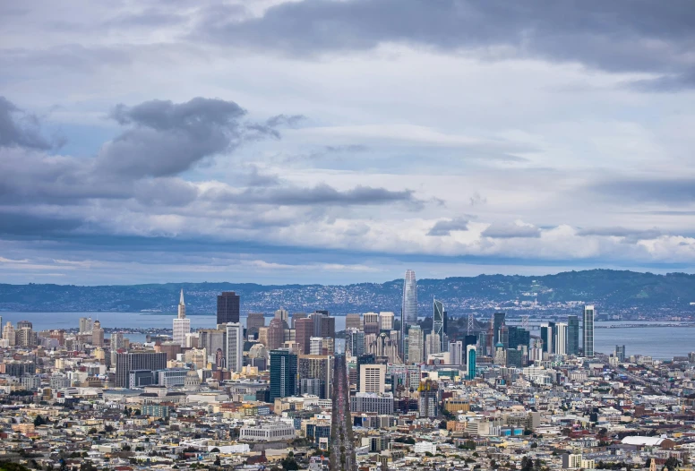 a view of a city from the top of a hill, by Joseph Severn, unsplash contest winner, renaissance, sf, on a cloudy day, 4k photo gigapixel, background image
