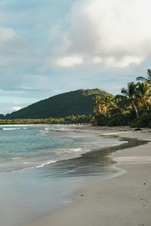 a man riding a surfboard on top of a sandy beach, mountainous jungle setting, white sandy beach, chocolate, calm evening