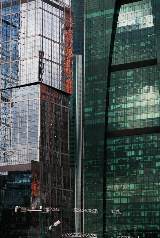 a group of tall buildings sitting next to each other, by Jan Rustem, moscow, hong kong buildings, with shiny glass buildings, 2077