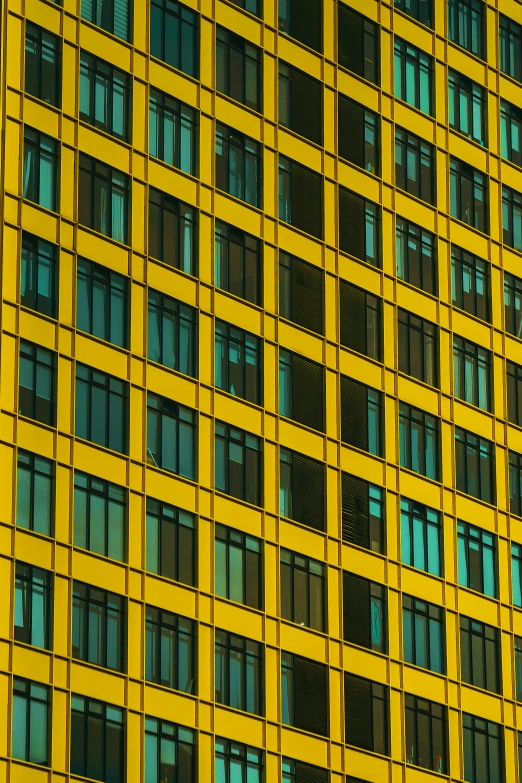 a tall yellow building with lots of windows, inspired by Andreas Gursky, unsplash contest winner, glowing hue of teal, patterned, zoomed, square shapes