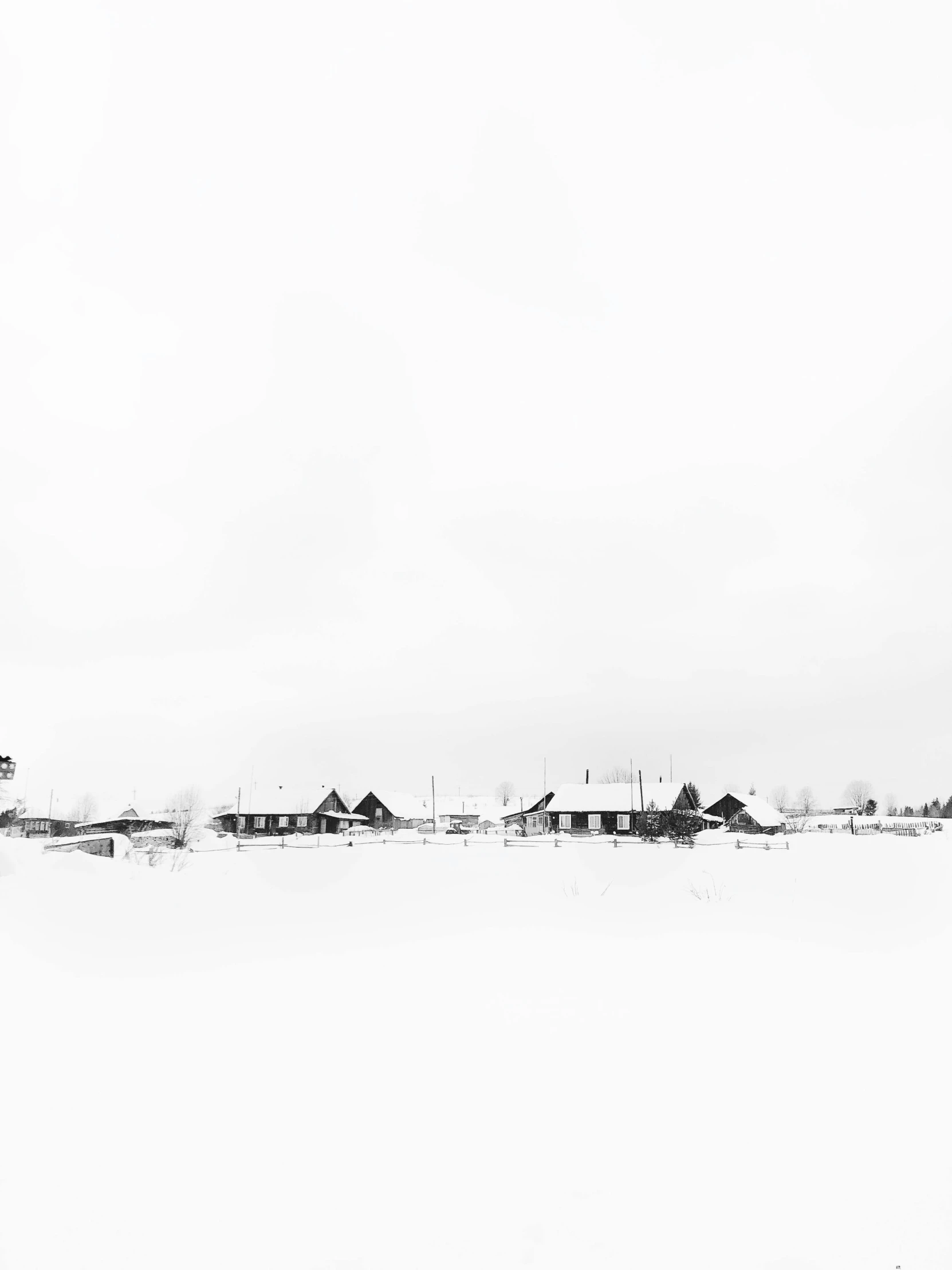 a black and white photo of a farm in the snow, by Peter Madsen, minimalism, several cottages, panoramic shot, jovana rikalo, white bg