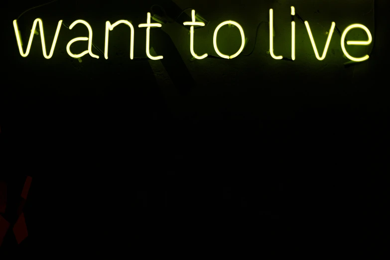 a neon sign that says i want to live, plant, toward to the camera, vanta black, splento