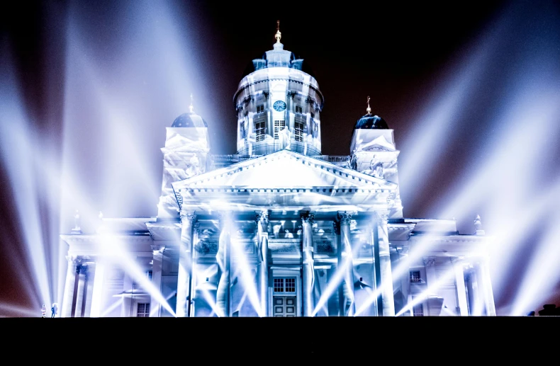 a large building with lights in front of it, a hologram, by Samu Börtsök, unsplash contest winner, hyperrealism, cathedral!!!!!, concert lighting, white marble buildings, stålenhag