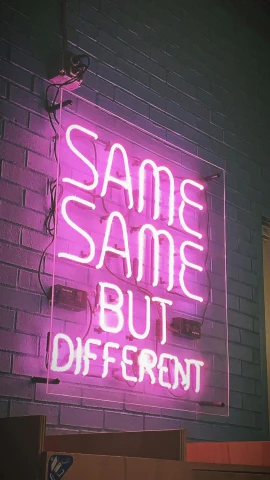 a neon sign that says same same but different, an album cover, unsplash, lime and violet, low quality photo, instagram story, candid photograph