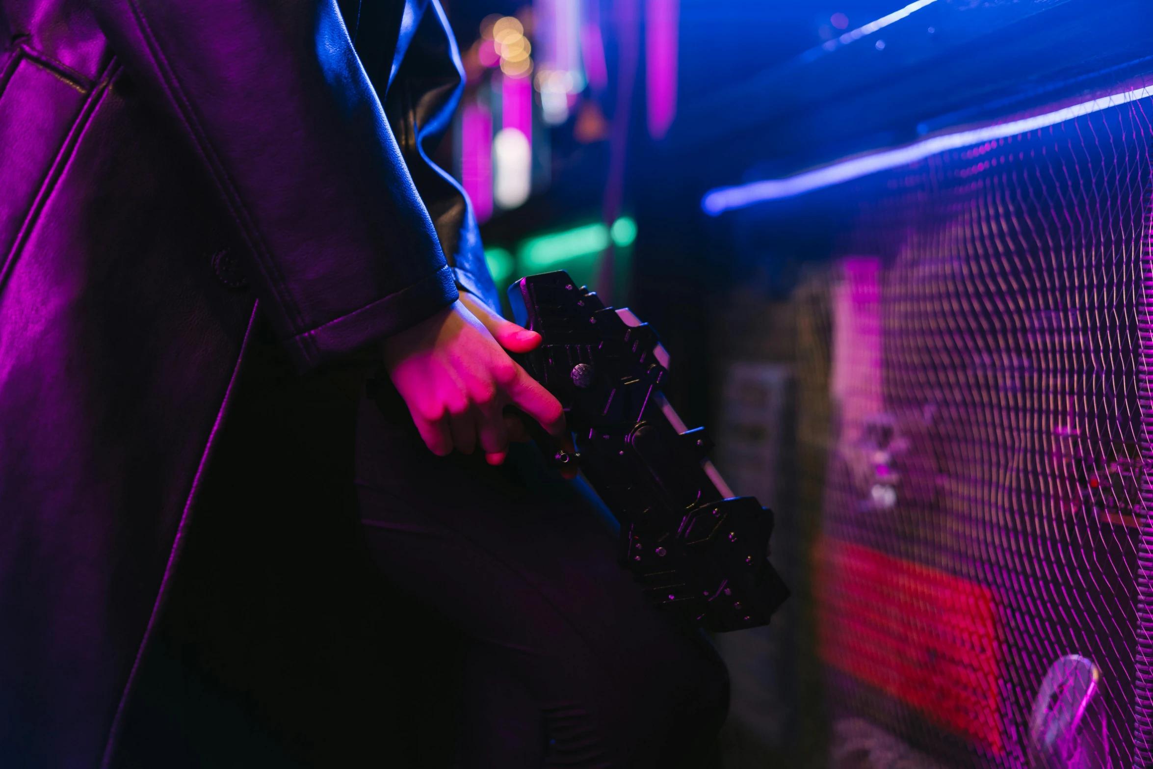 a close up of a person holding a camera, cyberpunk art, by Nick Fudge, unsplash, nightclub background, ground level shot, closed limbo room, bisexual lighting