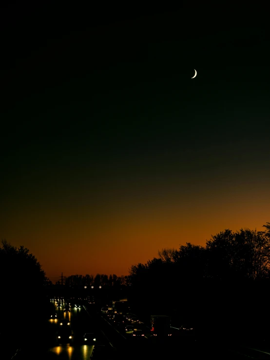 a city street at night with the moon in the sky, a picture, by Sebastian Spreng, hurufiyya, silhouette :7, crescent moon, break of dawn on venus, from wheaton illinois