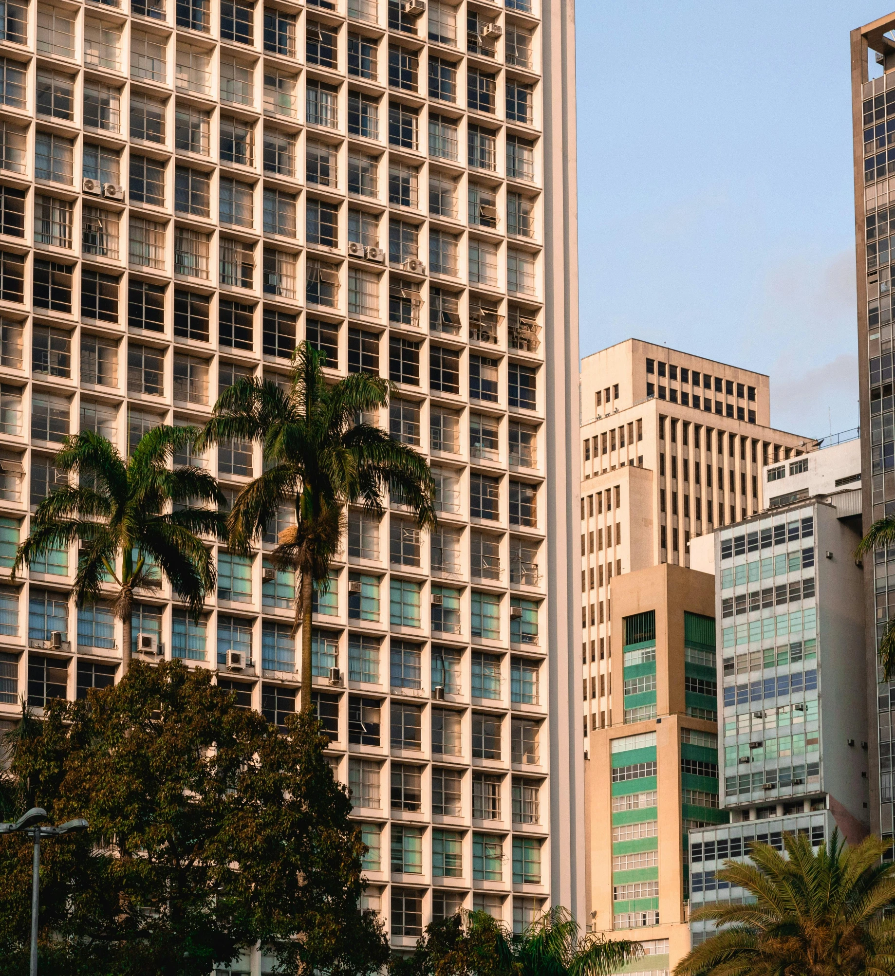 a group of tall buildings sitting next to each other, brutalism, puerto rico, getty images, zoomed in shots, avenida paulista