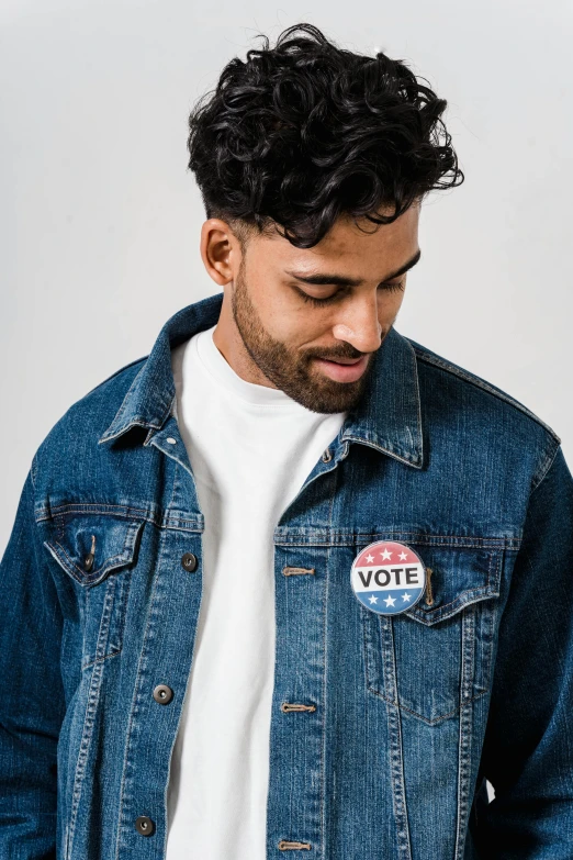 a man in a white t - shirt and a denim jacket, a cartoon, trending on unsplash, official government photo, ad campaign, reclections, lgbtq