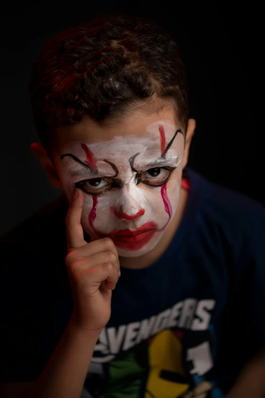 a boy with his face painted like a clown, a portrait, pexels, jordan peele's face, creepy pose, square, ((portrait))