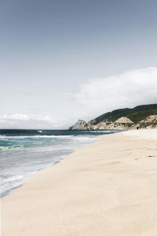 a man riding a surfboard on top of a sandy beach, a photo, by Lucas Vorsterman, trending on unsplash, minimalism, 2 5 6 x 2 5 6 pixels, portugal, mountains and ocean, slide show