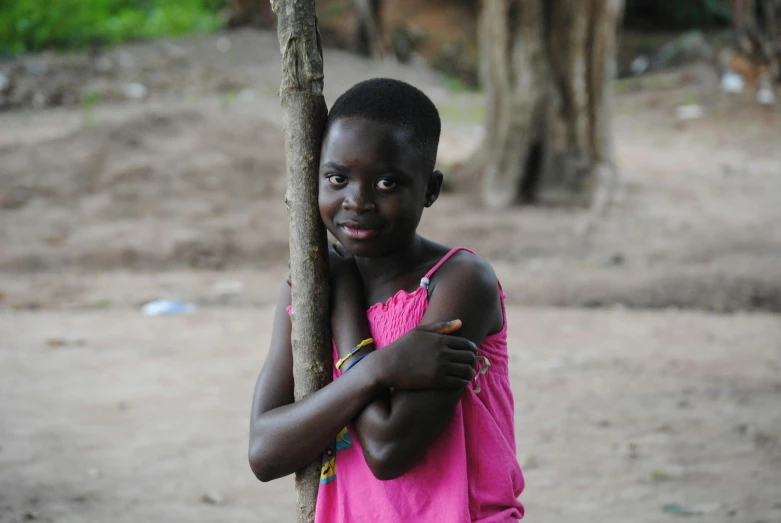 a young girl in a pink shirt holding a tree branch, obunga, she has beautiful bone structure, unedited