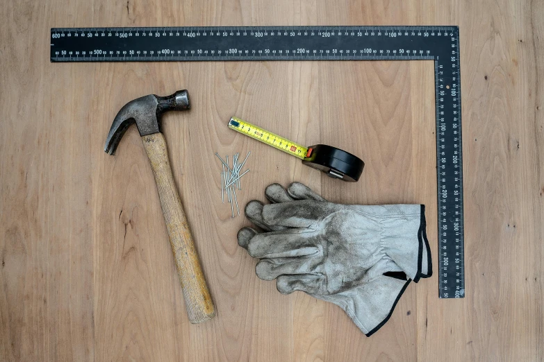 a hammer, gloves, and tape measure on a wooden floor, a portrait, pexels contest winner, hyperrealism, square lines, squared border, a gigantic, hand