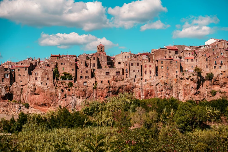 a group of buildings sitting on top of a cliff, a portrait, by Carlo Martini, pexels contest winner, renaissance, mud and brick houses, roman festival backdrop, promo image, youtube thumbnail