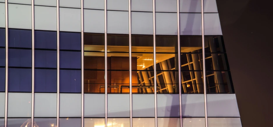 a building is reflected in the windows of another building, inspired by Andreas Gursky, pexels contest winner, modernism, at twilight, fan favorite, sitting down, high resolution photograph