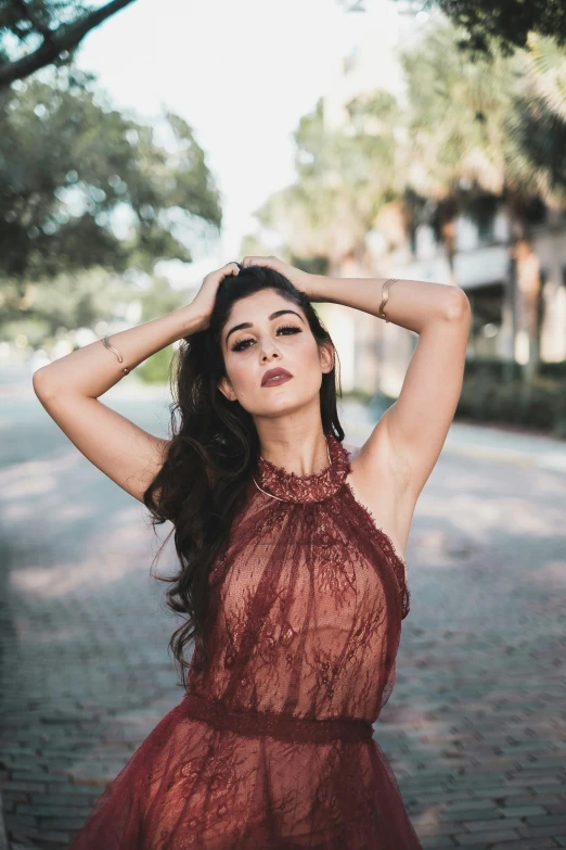 a woman in a red dress posing for a picture, by Robbie Trevino, trending on pexels, katherine mcnamara inspired, in savannah, julia sarda, alessio albi