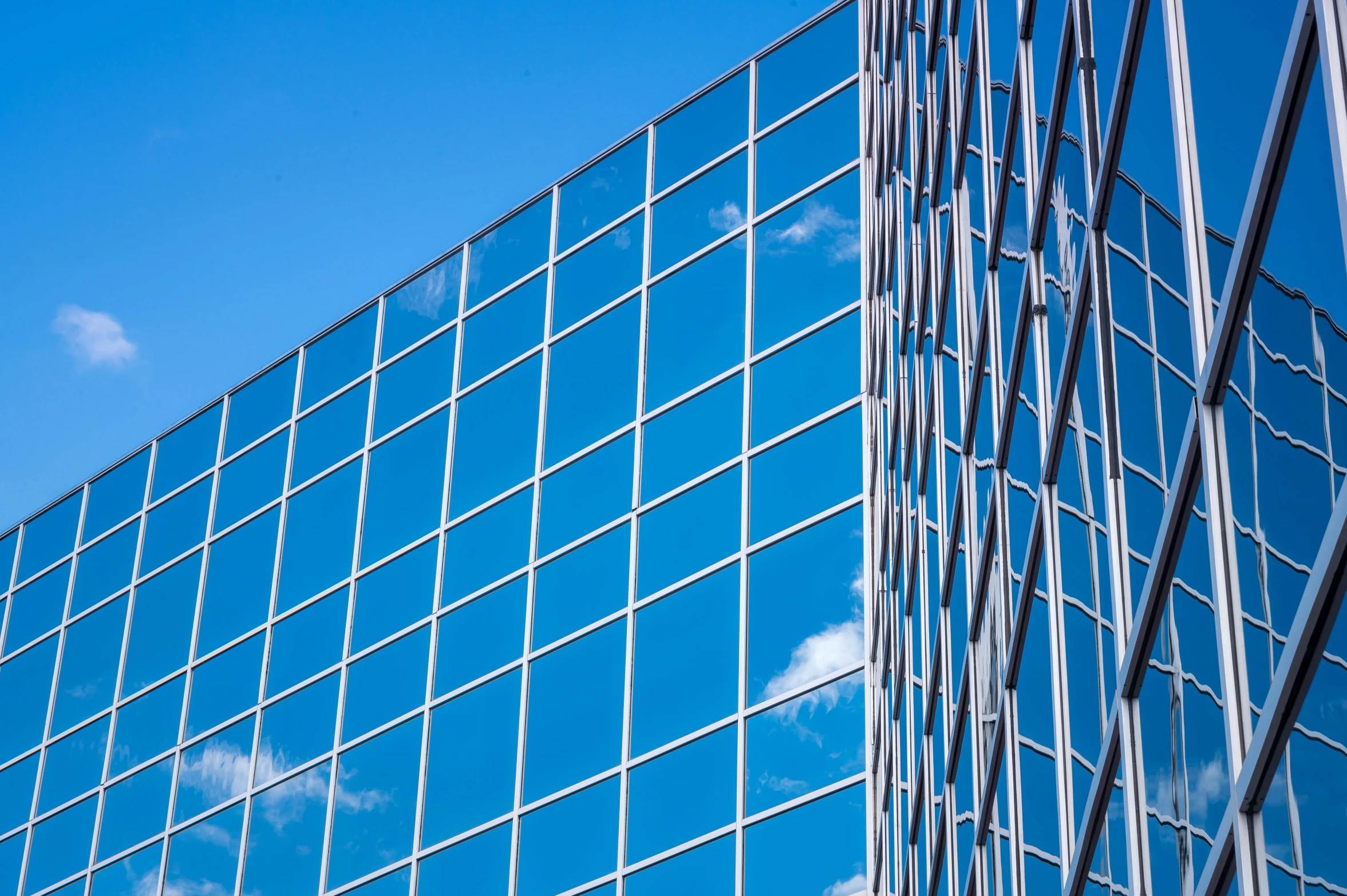 a glass building with a blue sky in the background, inspired by Richard Wilson, unsplash, square shapes, detiled, 1 6 9 5, thumbnail