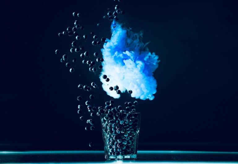 a glass filled with blue smoke and bubbles, an album cover, by Frederik Vermehren, pexels, art photography, 4 k hd wallpapear, mid shot, cmyk, culinary art photography