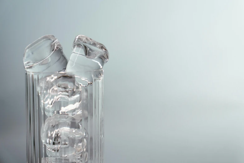 a clear glass vase filled with ice cubes, a 3D render, inspired by Cornelia Parker, unsplash, water pipe, detail shot, beer glasses, c 4 d style