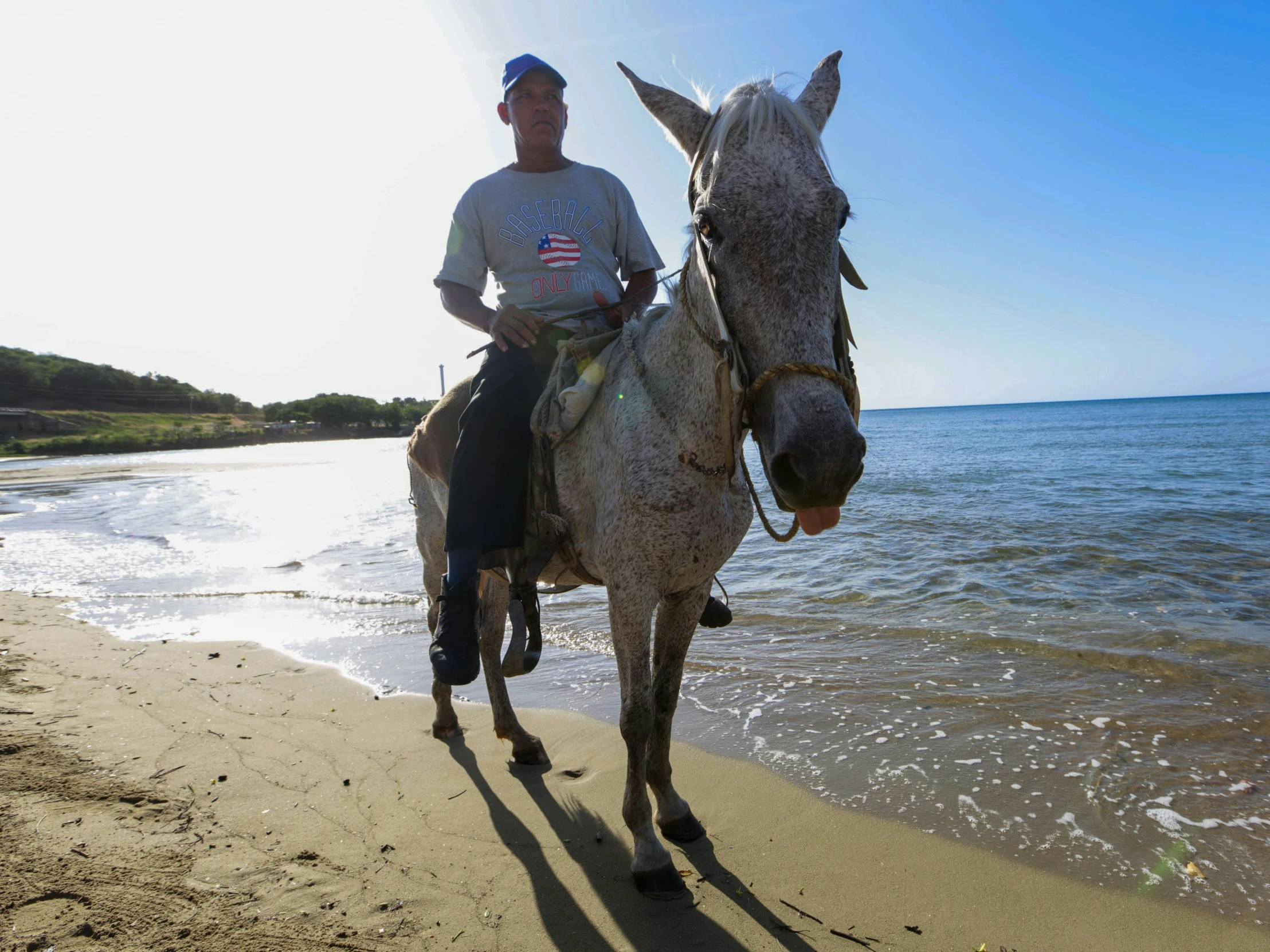 a man riding on the back of a horse on a beach, taras susak, 👰 🏇 ❌ 🍃, australian, grey