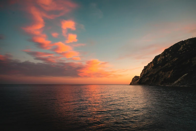 a sunset over a large body of water, pexels contest winner, capri coast, pink and teal and orange, grey, cinq terre