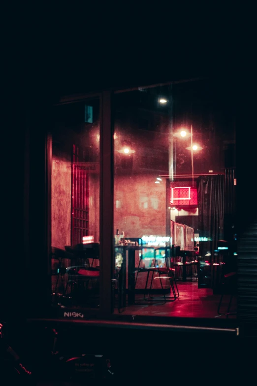 a motorcycle parked in front of a restaurant at night, a picture, unsplash contest winner, tonalism, red room, bars on the windows, turquoise and pink lighting, chinatown bar