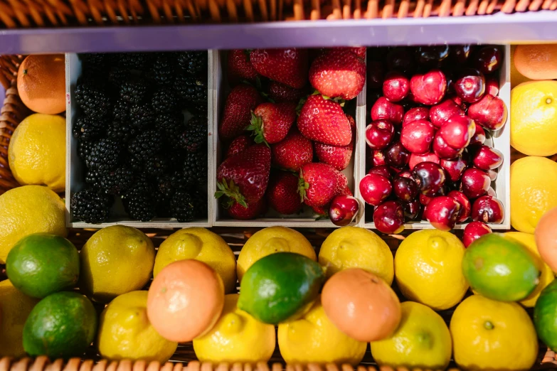 a wicker basket filled with assorted fruits and vegetables, unsplash, some red and purple and yellow, fruit machines, organized, berries inside structure