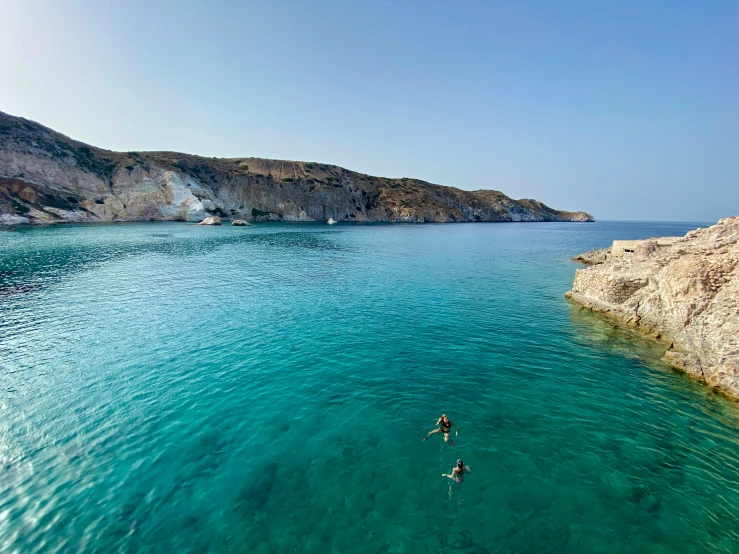 a person swimming in a body of water, les nabis, light blue water, byzantine, piroca, close together