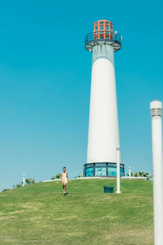 a person standing in front of a light house, sangyeob park, be running up that hill, the emerald coast, silo