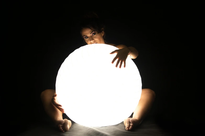 a woman holding a glowing ball in the dark, by Adam Marczyński, cool white color temperature, giant super moon, modern studio light soft colour, ethereal lighting - h 640