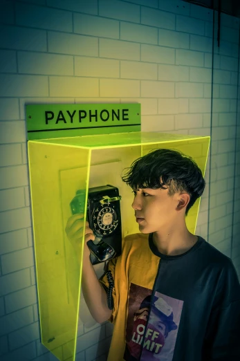 a man standing in front of a pay phone, an album cover, inspired by David LaChapelle, trending on pexels, hong june hyung, cyberpunk headset, translucent, cardboard