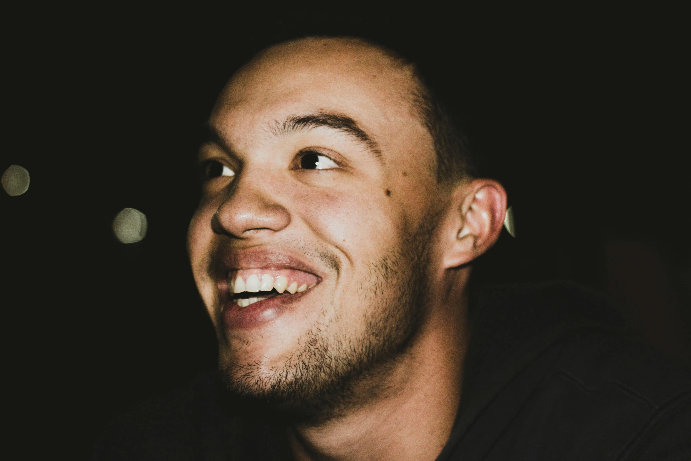 a close up of a man with a smile on his face, inspired by Seb McKinnon, pexels contest winner, antipodeans, mixed race, late night, head bent back in laughter, liam brazier and nielly