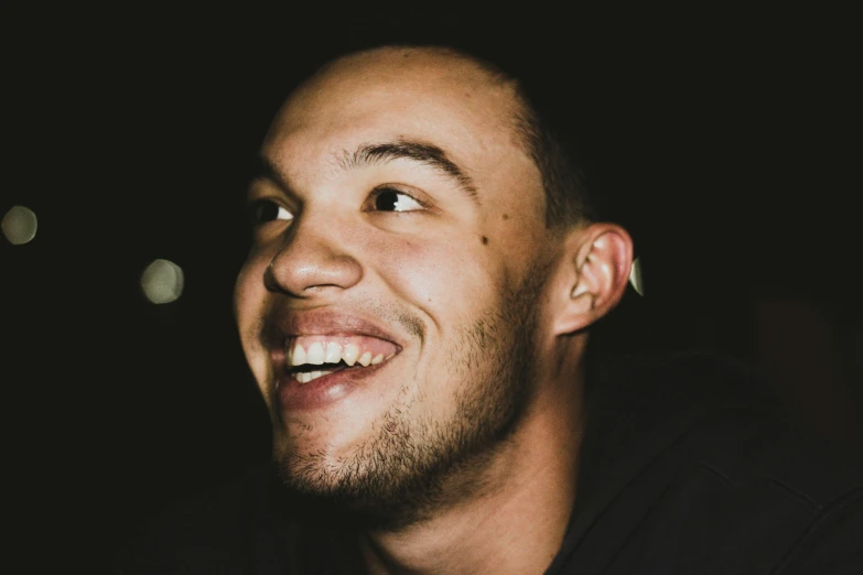 a close up of a man with a smile on his face, inspired by Seb McKinnon, pexels contest winner, antipodeans, mixed race, late night, head bent back in laughter, liam brazier and nielly