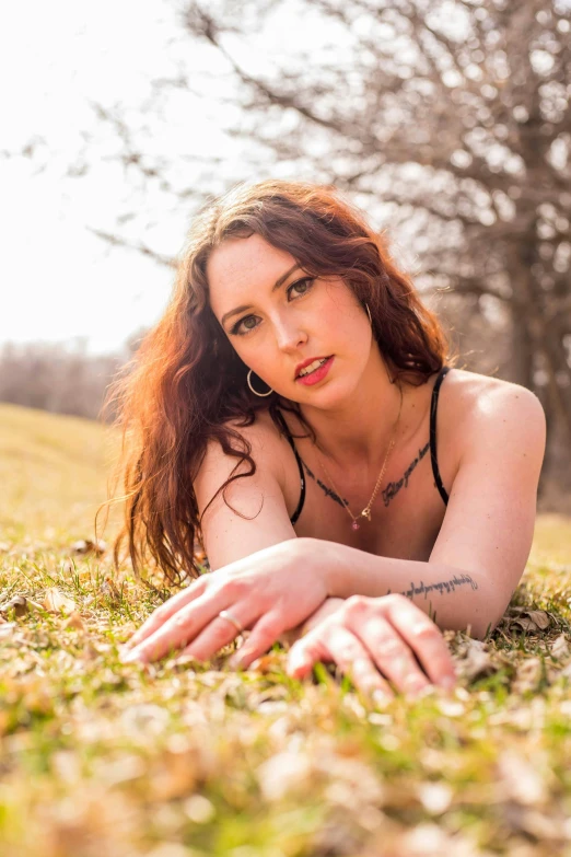 a beautiful young woman laying in the grass, reddit, renaissance, headshot and bodyshot, 5 0 0 px models, inked, spring season