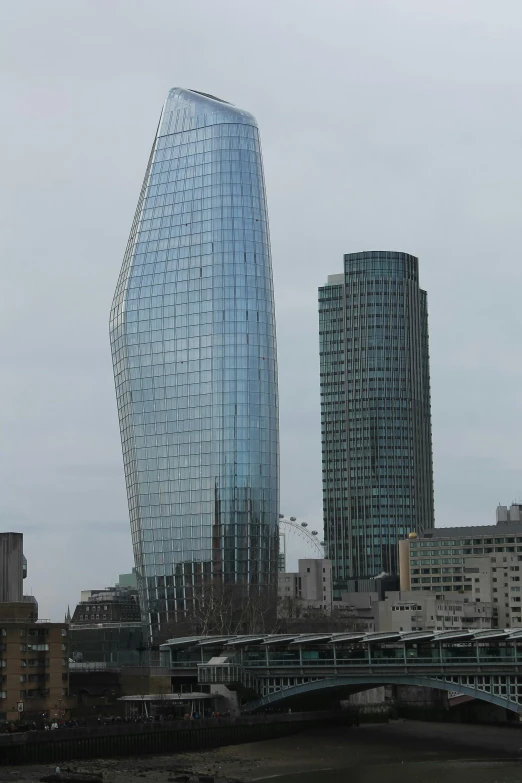 a bridge over a body of water with tall buildings in the background, inspired by Zaha Hadid, glass obelisks!!, london, curves!!, square nose