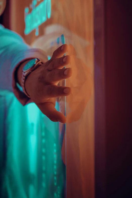 a close up of a person holding a cell phone, inspired by Elsa Bleda, pexels contest winner, interactive art, door to lab, translucent neon, capsule hotel, color ( sony a 7 r iv