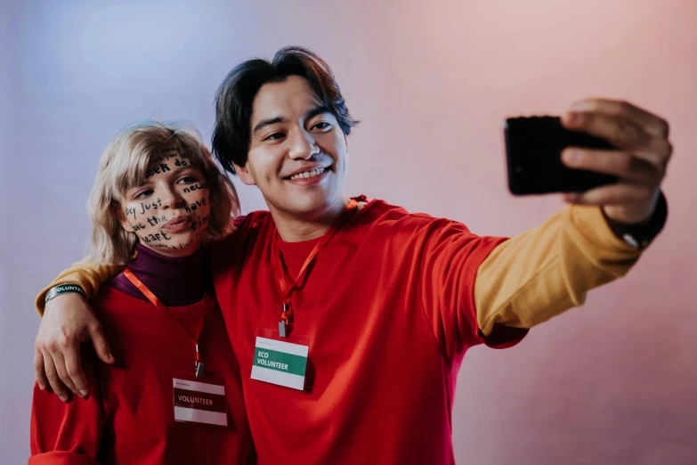 a man and a woman taking a selfie, by Jang Seung-eop, trending on pexels, realism, cosplayer dressed like a crab, all from the group nct, human face with bright red yes, educational