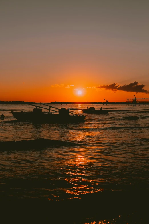 a couple of boats sitting on top of a body of water, by Robbie Trevino, pexels contest winner, sunsetting color, 3 boat in river, high quality photo, high resolution photo