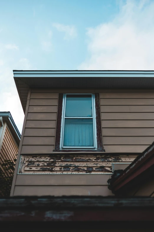 a brown house with a blue sky in the background, unsplash, cracked picture window, humidity mold, background image, multiple stories