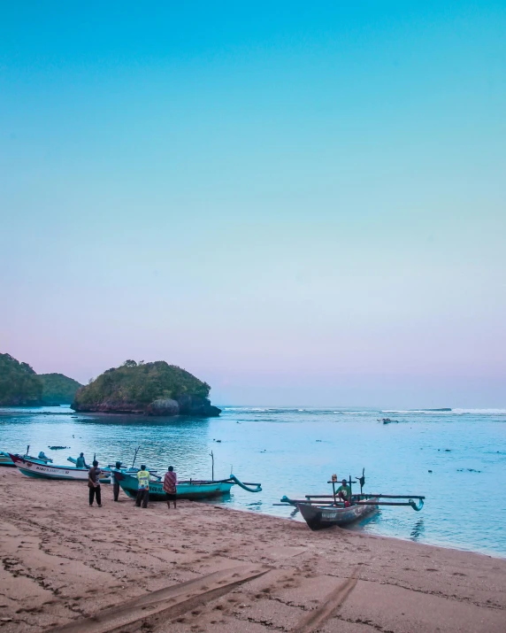 a group of boats sitting on top of a sandy beach, by Jessie Algie, pexels contest winner, sumatraism, pastel hues, early evening, bali, two medium sized islands