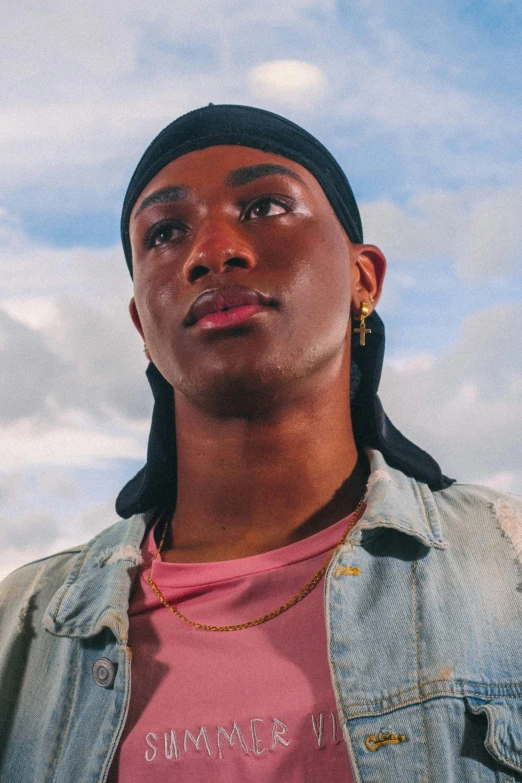 a man wearing a pink shirt and a denim jacket, trending on pexels, realism, ashteroth, well lit sky, berets, ( ( dark skin ) )