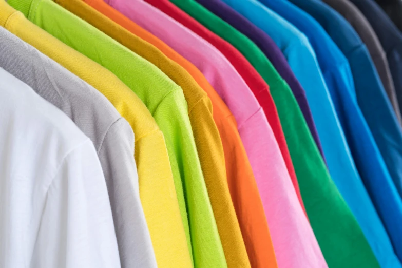 a row of colorful shirts hanging on a rack, pexels, color field, colored neons, long sleeves, sport t-shirt, thumbnail