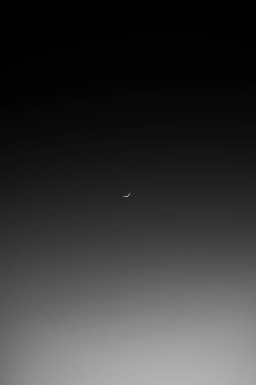 a black and white photo of a plane in the sky, a minimalist painting, by Chris Friel, minimalism, phone wallpaper hd, moon, 2 5 6 x 2 5 6 pixels, black gradient background